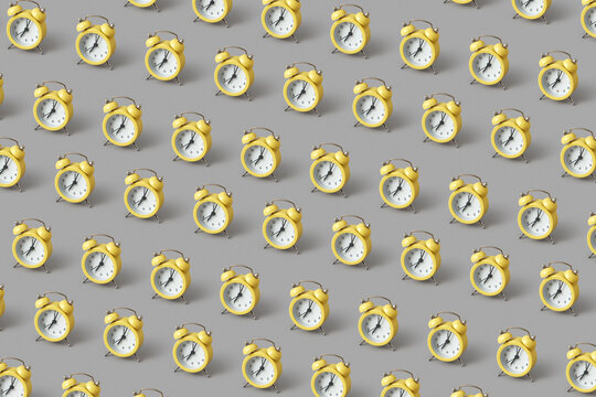 Pattern of yellow vintage alarm clocks