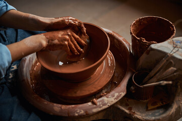 Image of process manufacturing ceramic tableware in pottery workshop
