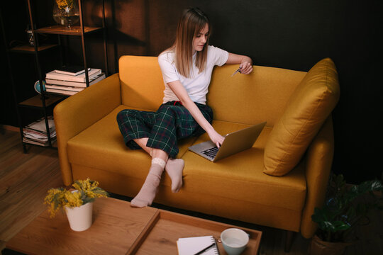 Woman Shopping Online On Sofa