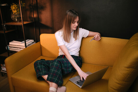 Woman Shopping Online On Sofa