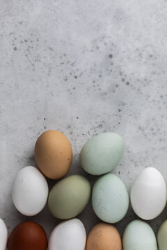 Miixed colored eggs on concrete surface
