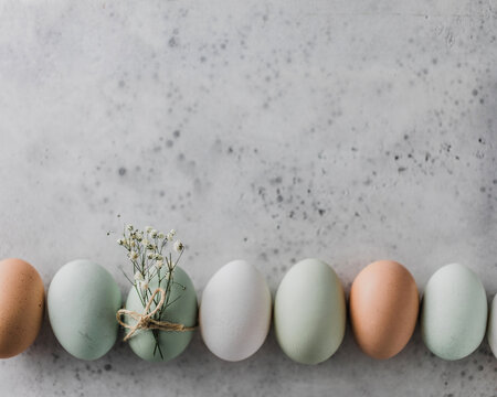 Pale colored eggs and flower sprig