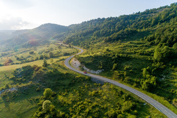 Driving across green landscape