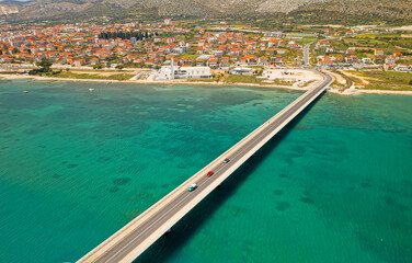 Fototapeta na wymiar Aerial top view of a long bridge above a sea, island Ciovo in Croatia
