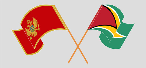 Crossed and waving flags of Montenegro and Guyana