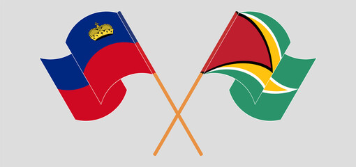 Crossed and waving flags of Liechtenstein and Guyana