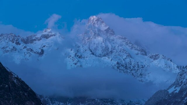 The Olan peak in the Ecrins National Park at twilight (time-lapse). Major peak of the GR54 Ecrins Massif hiking tour. Valgaudemar Valley, Hautes-Alpes, French Alps, France