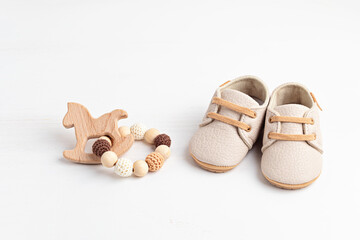 Gender neutral baby shoes and accessories. Organic newborn fashion - obrazy, fototapety, plakaty