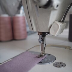 
photography of weaver production, industrial machines, threads, fabric trimmings
