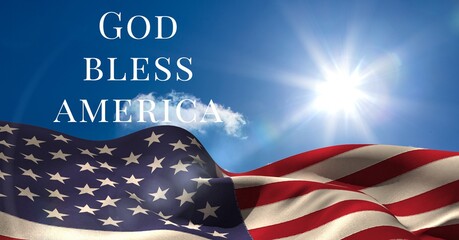 Fototapeta premium Composition of text god bless america over waving american flag on sunny blue sky