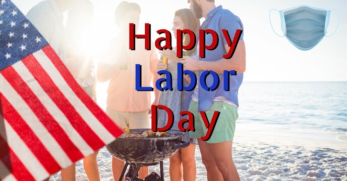 Composition of happy labor day greeting and american flag over family by the sea