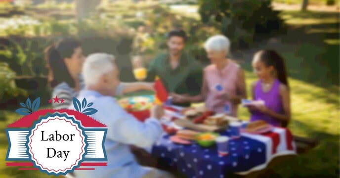 Composition of labor day text and logo over family having celebration picnic