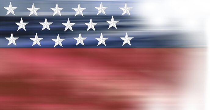 Composition of white stars on blue and blurred red of american flag fading off to the right