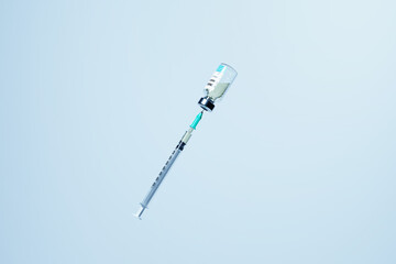 Syringe drawing Covid-19 vaccine from vial