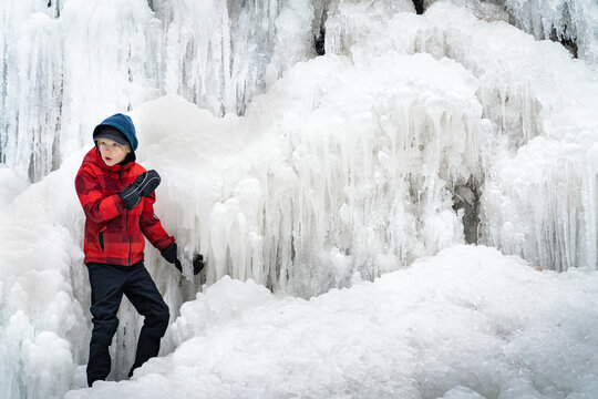 Excited Boy Exploring Tiffany Falls Hamilton Frozen Waterfall in