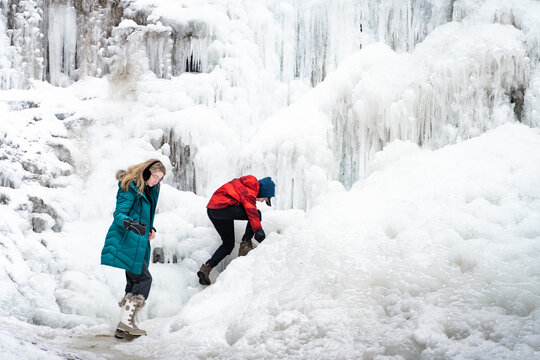 Children Exploring Tiffany Falls Hamilton Frozen Waterfall in Wi