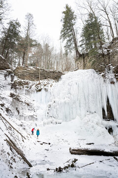 Kids Exploring Tiffany Falls Hamilton Frozen Waterfall in Winter