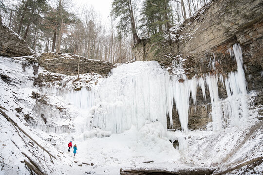 Children Exploring Tiffany Falls Hamilton Frozen Waterfall in Wi