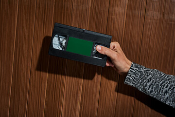 man holding a videotape