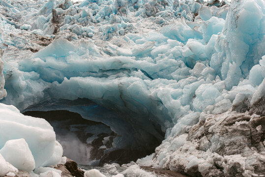 Hole in melting glacier in nature
