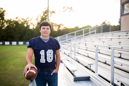 Teen Holding Football