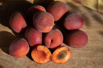 Red apricots on a wooden table