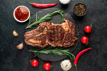 Obraz na płótnie Canvas grilled cowboy beef steak on stone background