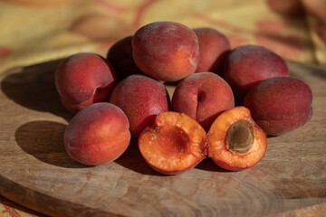 Red apricots on a wooden table