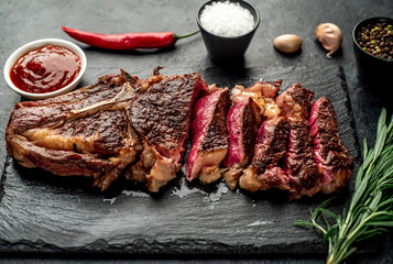 grilled cowboy beef steak on stone background