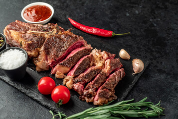 grilled cowboy beef steak on stone background