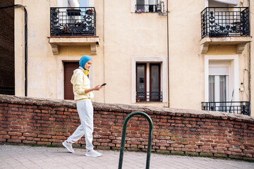 Muslim Woman Using Phone