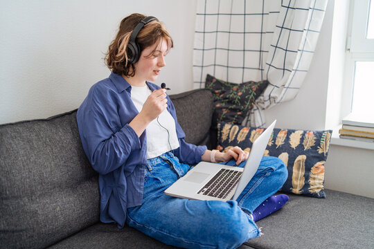 young woman recording podcast