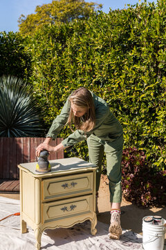 Woman Upcycles Night Stand Furniture Outdoors