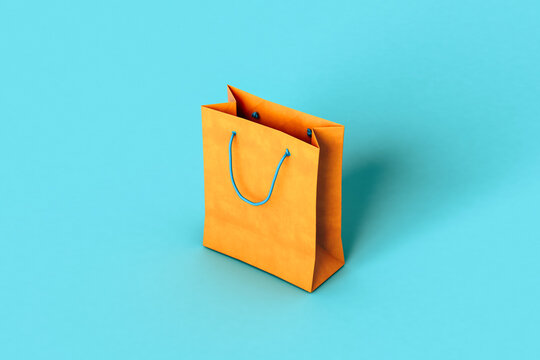 Orange paper bags on blue background