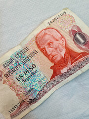A old and out of circulation Argentina one peso paper bank note. - obrazy, fototapety, plakaty