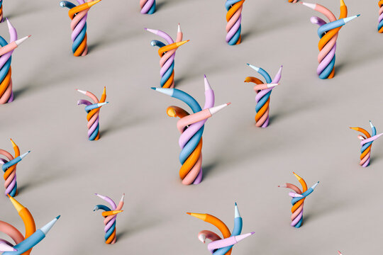 Twisted colorful pencils on grey background