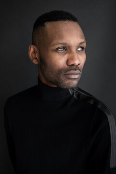 Male Model Portrait In Black Background