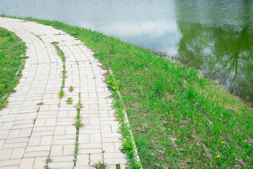 Tile path along the pond.