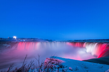 Niagara waterfall at night with vivid colors in winter