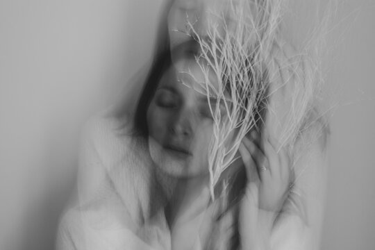 beautiful woman portrait with motion blur, female face black and white