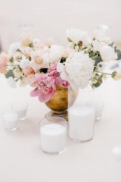 flower bouquet in vase with candles decoration