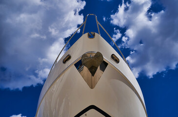 the bow of the ship against the sky and clouds
