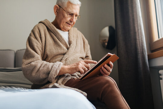 Old Man Using Digital Tablet