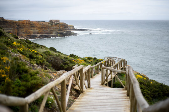 Wooden path on the cliff of Ericeira, Portugal