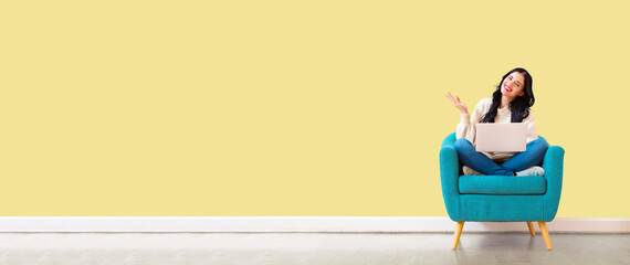 Young woman using her laptop