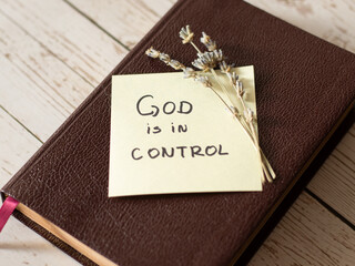 God is in control. Trust God and Jesus Christ with your situation. Handwritten note on closed Holy...