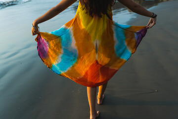happy woman walking in the beach