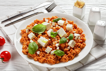 eggs scrambled with tomatoes and feta cheese