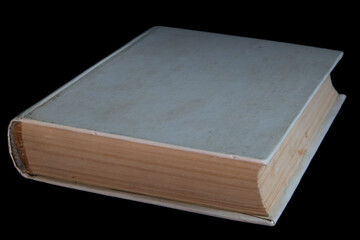 An old white book with a blank cover for text. Isolated on a black background