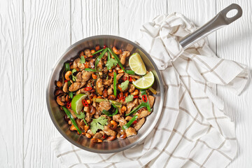 Thai cashew chicken stir fry in a pan